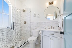 Immaculate and sparkling clean bathroom with plenty of natural light flowing in!