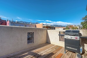 Rooftop BBQ grill with stunning mountain views—ideal for outdoor cooking and dining.