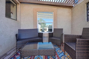Cozy outdoor seating area, perfect for relaxing or enjoying a morning coffee on the private deck.