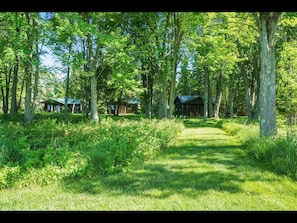 located back off the lake with beautiful trees surrounding the cabins