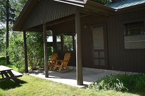 front porch with lake view and adirondack rocking chairs
