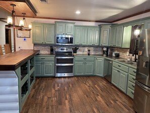 Green with envy cabinets brightens this space up!
