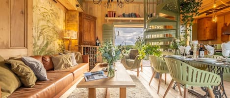 Olive Tree House, Sussex: Stunning open-plan living, dining area with doors leading out to decked terrace