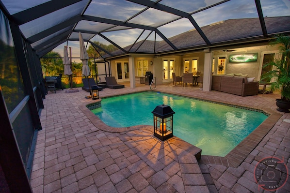 Screened paver lanai, waterfall pool & 2 tiered deck make a special outdoor life