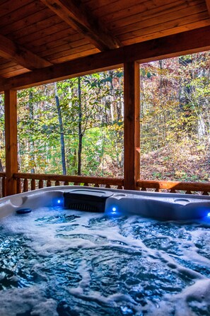 Large, covered hot tub for relaxing in all seasons and weather