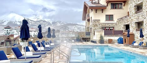 Heated rooftop terrace pool with 2 hot tubs to enjoy year round