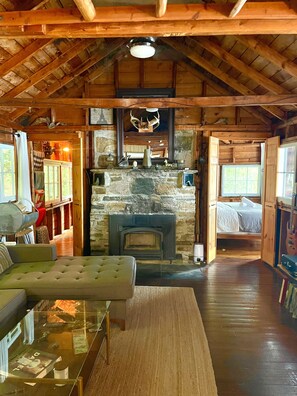 Main cottage - living room and stone fireplace 