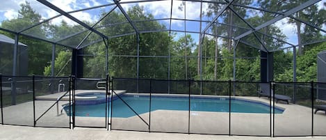 Screened-in, gated private pool.  Gate accessed, no neighbors behind the house.