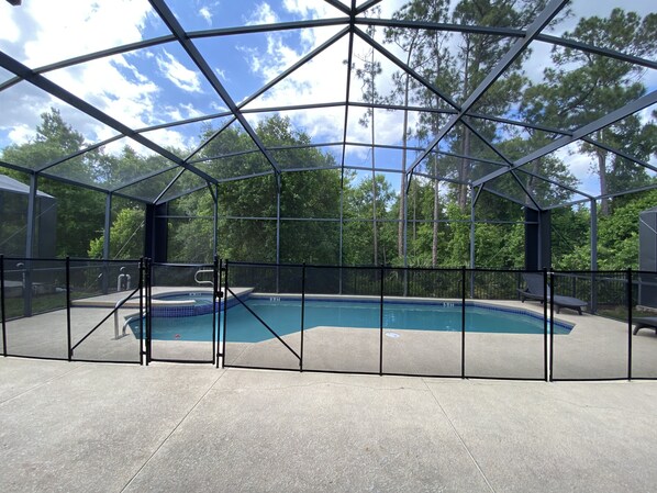 Screened-in, gated private pool.  Gate accessed, no neighbors behind the house.