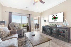 Living Room with Cable TV, Sleeper Sofa, and Access to Both the Sunroom and Open Deck- Both Offer an Incredible Lake View!