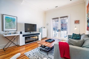 Living Room with Smart TV and Porch Access