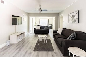 Large Living room with Two seating areas and smart TV