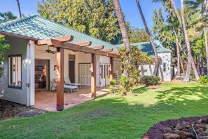 Two of four bedrooms open to trellised lanais