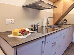 Kitchen, Countertop, Kitchen Appliance, Kitchen Sink, Cabinetry, Flooring, Wood, Plumbing Fixture, Furniture, Major Appliance
