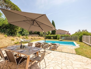 Sky, Plant, Furniture, Property, Table, Building, Chair, Shade, Outdoor Furniture, Tree