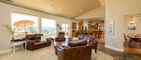 The living room is spacious and open to the kitchen and dining area