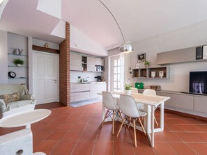 Furniture, Table, Countertop, Cabinetry, Kitchen, Lighting, Wood, Houseplant, Interior Design, Flooring