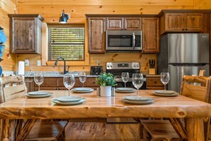 Kitchen has all the essentials and a great table for family game night.