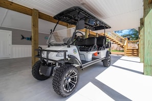 Use the provided 6 seater electric golf cart to get to the beach and explore the island