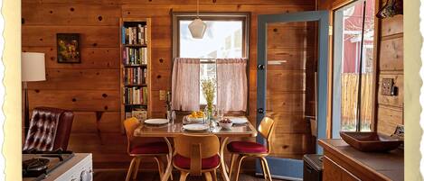 This is our quaint dining area, with views of our expansive private yard.