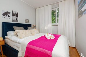 Comfortable double bed in the bedroom. 