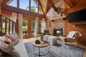 Stone detailing and an electric fireplace in the living room.