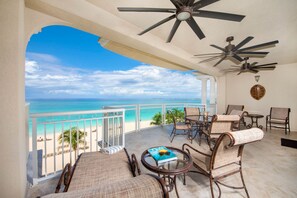 Furnished private balcony overlooking Seven Mile Beach. 