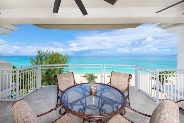 Alfresco dining table on the balcony with seaside views. 