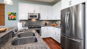 Features granite countertops and stainless-steel appliances