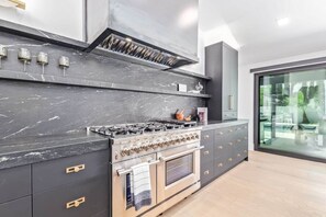 Custom gourmet chef's kitchen with high end appliances