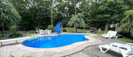 Another view of the fenced-in pool area. 