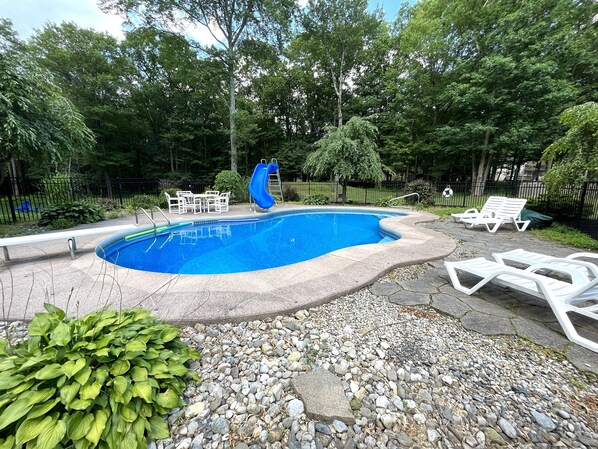 Another view of the fenced-in pool area. 