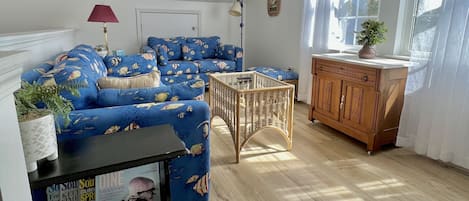 Bright Living room with a tranquil view of the Wilmington River