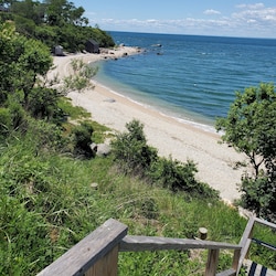 Secluded beach cove with limited public access