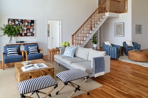 Spacious living room with fireplace overlooking Long Island Sound