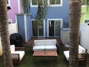 enjoy the comfy outdoor furniture under the beautiful and shady palms. 