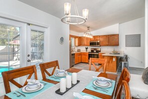 The open floor plan makes cooking and eating together simple.