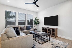 Main floor living area with TV