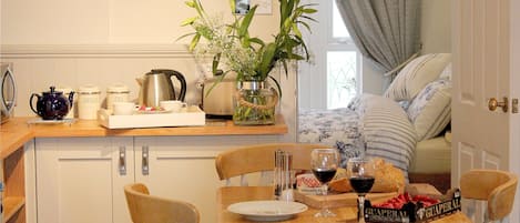 Kitchen, with fridge and kettle, toaster, cooker, dishwasher and utensils