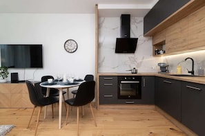 The fully equipped kitchenette includes everything you need for a home-cooked meal.