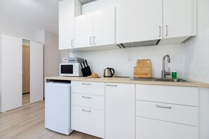 The fully equipped kitchenette includes everything you need for a home-cooked meal.