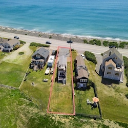 Aerial view, across the street from the ocean, large private lawn area and roof deck to relax, sunbath and grill