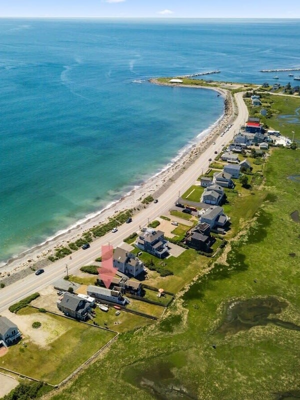 Aerial view, across the street from the ocean, large private lawn area and roof deck to relax, sunbath and grill