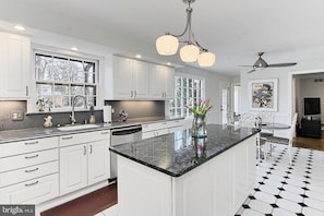 Kitchen with island and eat-in breakfast area