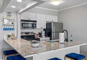 The kitchen boasts granite countertops.