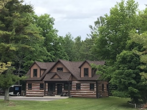 front of cabin with porch and seating