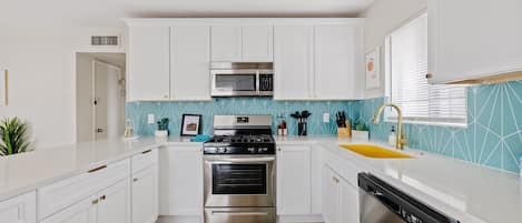 Completely remodeled modern kitchen with every major appliance, soft-close doors/drawers and stunningly beautiful quartz counter tops.