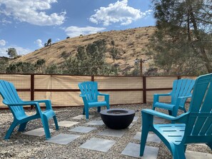 Enjoy the outdoor fire pit located on the side yard while stargazing.