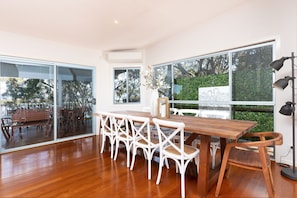 Large dining table to enjoy meals with family & friends overlooking Wallis Lake