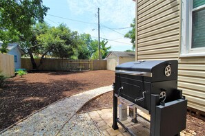 Charcoal grill and wood smoker.